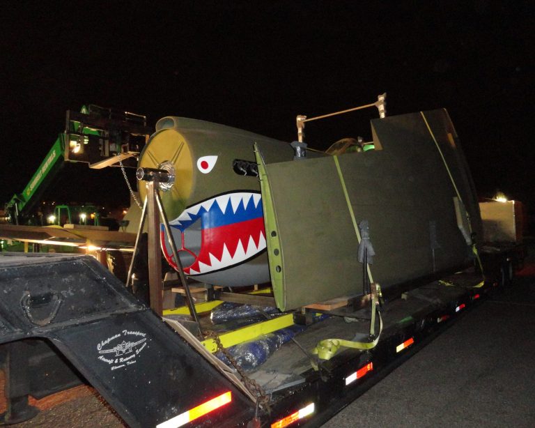 In this photo made available by Rolando Gutierrez in Jan. 21, 2014 shows a Curtis P-40 Warhawk fighter plane as it is loaded for transport in San Diego, CA. The warplane is bound for the World War II Museum in New Orleans, LA. The P-40E is the model flown by the 1st American Volunteer Group during World War II. It was immortalized in military lore in a John Wayne film. (AP Photo/Rolando Gutierrez, HO)