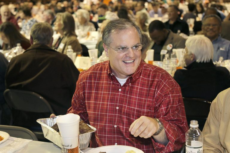 Sen. Mark Pryor, D-Ark., holds a pan of raccoon meat at the Gillett Coon Supper in Gillett, Ark., on Saturday. (AP/Danny Johnston)