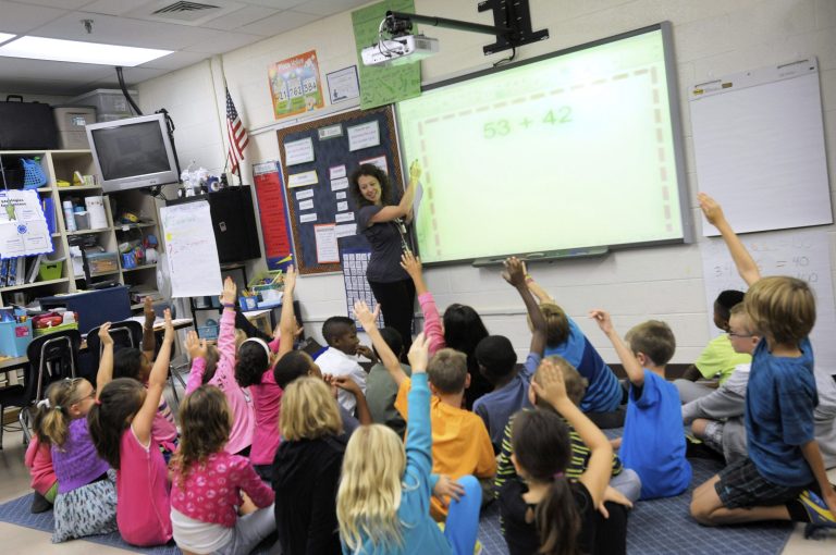 A third-grade teacher at Silver Lake Elementary School in Middletown, Del., teaches a math lesson. (AP/Steve Ruark)
