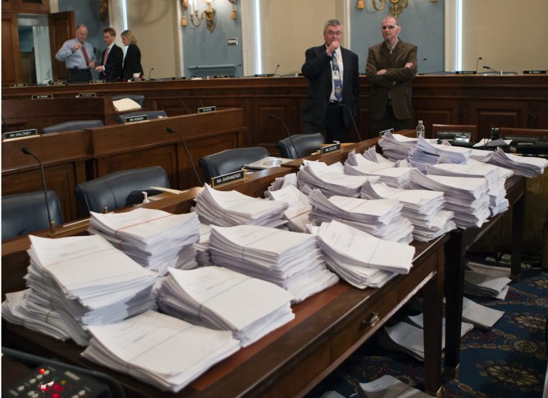 This May 15, 2013 file photo shows stacks of paperwork awaiting members of the House Agriculture Committee on Capitol Hill in Washington as it meets to consider proposals to the 2013 Farm Bill. (AP/J. Scott Applewhite)