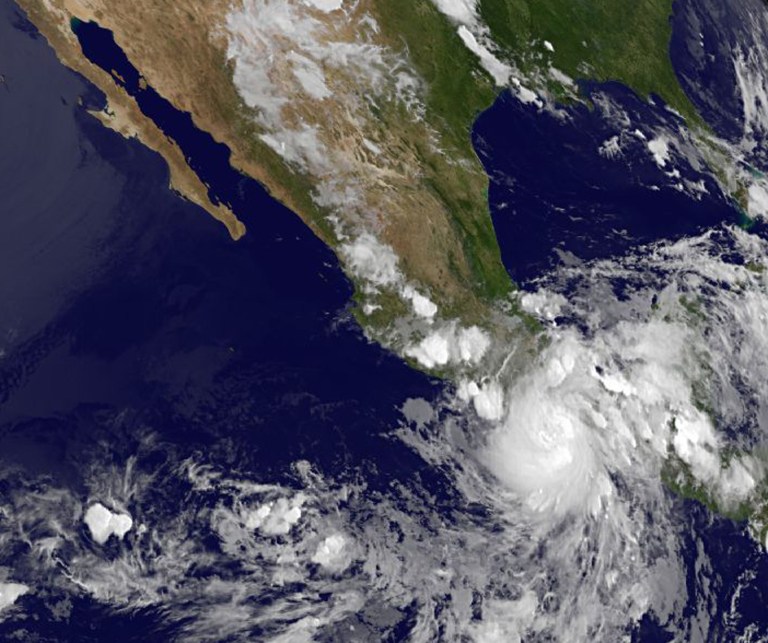   This image provided by NASA acquired Friday at 11 p.m. EDT shows Hurricane Carlotta slammed into Mexico's resort-studded Pacific coast late Friday, toppling trees and lashing hotels while authorities evacuated people from low-lying areas. The rapidly changing hurricane made landfall as a Category 1 storm near Puerto Escondido, a laid-back port popular with surfers, and is expected to push inland and northward in the direction of Acapulco. (AP Photo/NASA)  