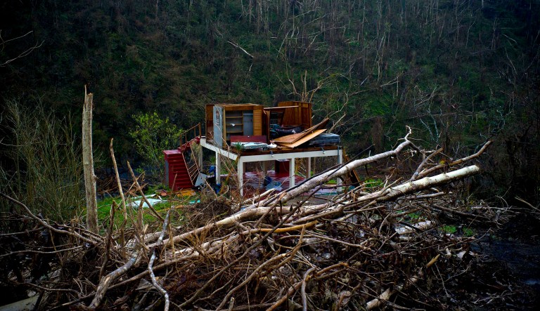The official Puerto Rico death toll in connection to Hurricane Maria has risen to 34, Puerto Rico Gov. Ricardo Rossello announced Thursday evening following President Trump's visit. (AP Photo/Ramon Espinosa)