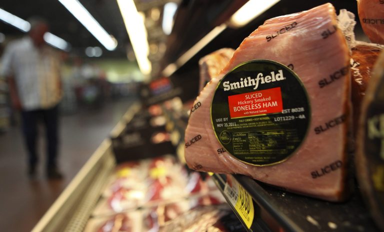 This Sept. 6, 2011 photo, shows a Smithfield ham at a grocery store in Richardson, Texas. Smithfield Foods Inc.'s fiscal first-quarter net income rose 8 percent, as the world's biggest hog producer charged higher prices and sold more packaged meats. (AP Photo/LM Otero)