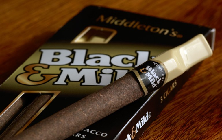 This undated product image provided by Altria shows John Middleton Co.'s Black & Mild cigars. Under a Food and Drug Administration proposal to regulate cigars and other tobacco products the same as cigarettes, cigar makers would have to remove descriptions like 