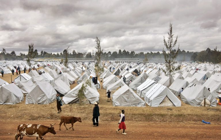   FILE - In this Saturday, Jan. 19, 2008 file photo, a sea of tents made out of plastic sheeting fills a camp for the displaced in the showground in Eldoret, Kenya, following post-election violence. A treaty that African nations hope will lead to the fair and humane treatment of people displaced in their own countries went into force Thursday, Dec. 6, 2012, more than three years after it was conceived by the African Union. (AP Photo/Ben Curtis, File)  