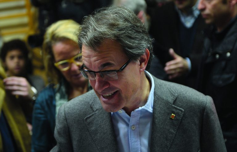 The leader of center-right Catalan Nationalist Coalition (CiU), Artur Mas smiles after casting his vote during elections for the 'Generalitat de Catalunya' (Catalan Autonomous Government) in Barcelona, Sunday, Nov. 25, 2012. Voters in Catalonia begin casting their ballots in regional elections that could determine the future shape of Spain. If voters give the regional government strong support, its leader pledged to hold a referendum asking Catalans if they'd prefer to split from Spain and go it alone in the 27-member EU. (AP Photo/Manu Fernandez)