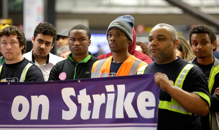 Security workers, baggage handlers, and other workers decided to strike as part of their effort to fight for a $15 per hour minimum wage. (AP Photo/Ted S. Warren)
