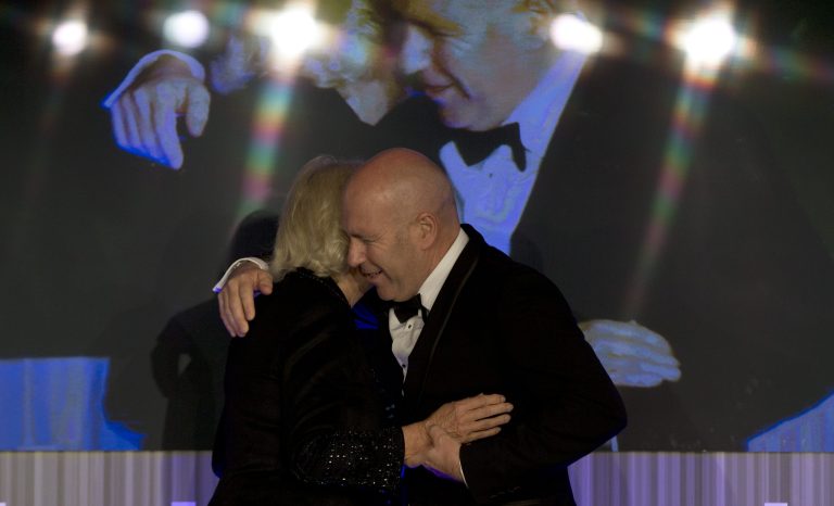 Winner of the Man Booker for fiction 2014 Australian author Richard Flanagan, author of 'The Narrow Road to the Deep North. hugs Camilla, Duchess of Cornwall as he is presented with the prize at the Guildhall in London, Tuesday, Oct. 14, 2014. (AP Photo/Alastair Grant, Pool)