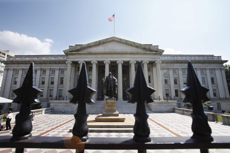 FILE - In this Aug. 8, 2011 file photo, a statue of former Treasury Secretary Albert Gallatin stands outside the Treasury Building in Washington. The Treasury Department releases federal budget data for May on Wednesday, June 11, 2014. (AP Photo/Jacquelyn Martin, File)
