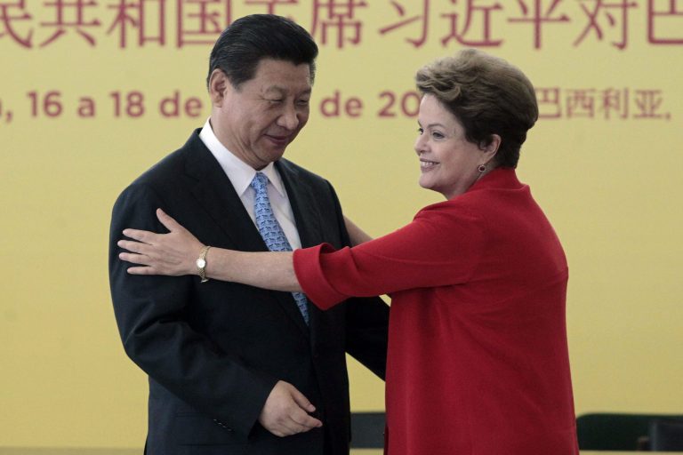 China's President Xi Jinping, left, and Brazil's President Dilma Rousseff, move to embrace after a signing ceremony at the Planalto Presidential Palace, in Brasilia, Brazil in 2014. In 2009, China pushed the U.S. aside to become Brazil's biggest trading partner. (AP Photo/Eraldo Peres)