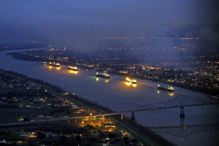River traffic is halted along the Mississippi River between New Orleans and Vacherie, La., due to a barge leaking oil in St. James Parish, La., Sunday. (AP Photo/Gerald Herbert)