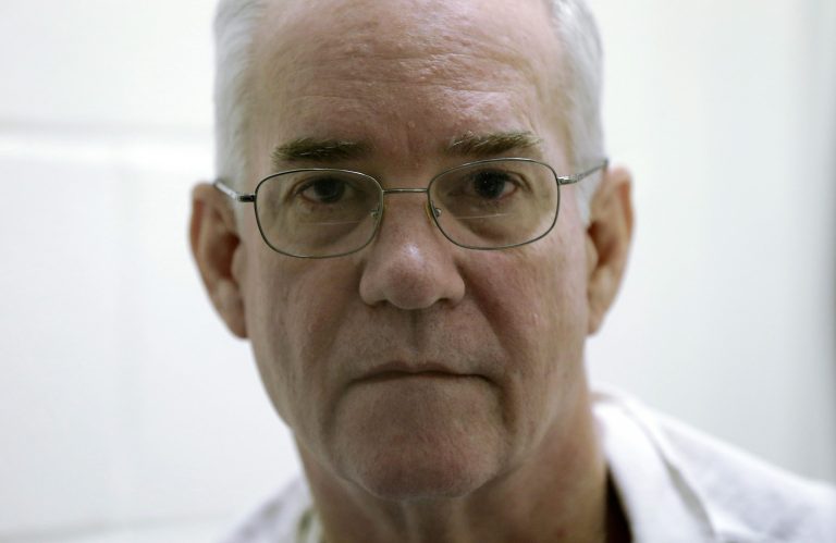 FILE - In this March 11, 2013 file photo, inmate Ed Graf pauses during an interview at the Alfred Hughes State Prison in Gatesville, Texas. Jurors are being selected for the retrial of a Graf who is charged in his two stepsons' deaths in a fire nearly 30 years ago. Sixty-two-year-old Graf faces charges of capital murder and injury to a child in the 1986 deaths of his 8- and 9-year-old stepsons Jason and Joby. (AP Photo/LM Otero, File)