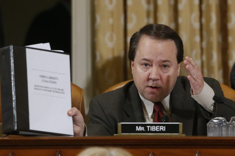 Rep. Pat Tiberi, R-Ohio, questions ousted IRS Chief Steve Miller and J. Russell George, Treasury Inspector General for Tax Administration, as they testify during a hearing at the House Ways and Means Committee on the Internal Revenue Service (IRS) practice of targeting applicants for tax-exempt status based on political leanings on Capitol Hill, in Washington, Friday, May 17, 2013. (AP Photo/Charles Dharapak)