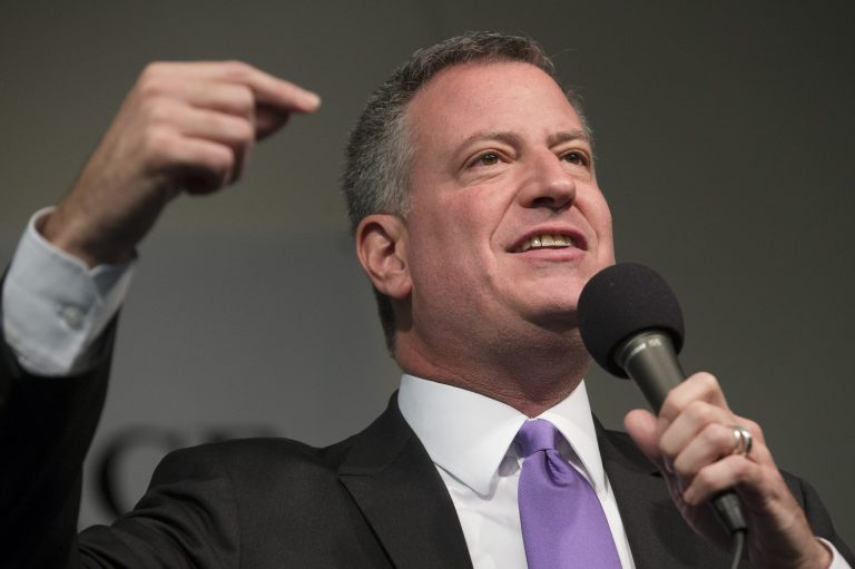 Mayor-Elect Bill de Blasio speaks during a tribute to South African leader Nelson Mandela at the National Action Network headquarters, Saturday, Dec. 7, 2013, in the Harlem neighborhood of New York. South Africa's first black president died Thursday after a long illness. He was 95. (AP Photo/John Minchillo)