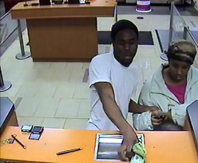 Surveillance photo of a man and the woman sought in an Oct. 12 Bethesda bank robbery.
Photo courtesy of Montgomery County police