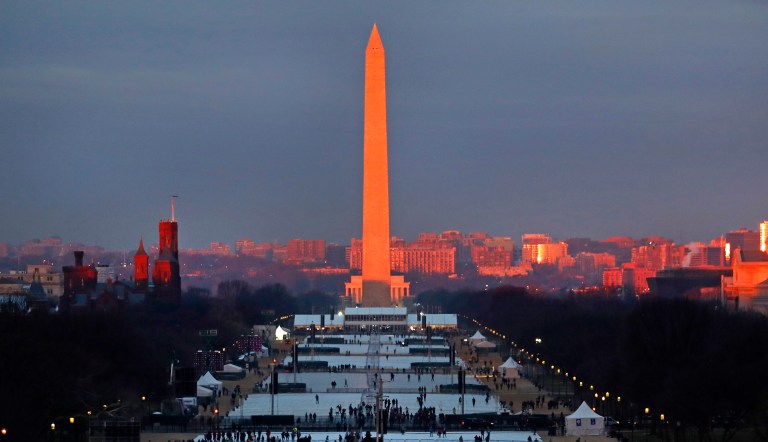 The crowd starts to fill the National Mall as the sun rises before the swearing in of Donald Trump as the 45th president of the Untied State during the 58th Presidential Inauguration at the U.S. Capitol. (AP Photo/Carolyn Kaster)