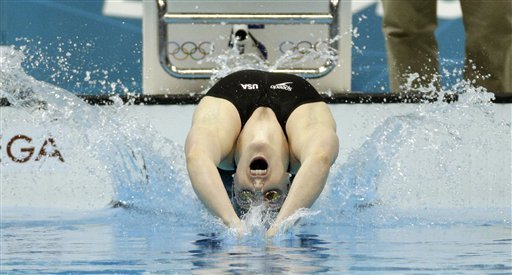 United States' Missy Franklin starts in the women's 100-meter backstroke swimming final at the Aquatics Centre in the Olympic Park during the 2012 Summer Olympics in London, Monday, July 30, 2012. (AP Photo/Michael Sohn)