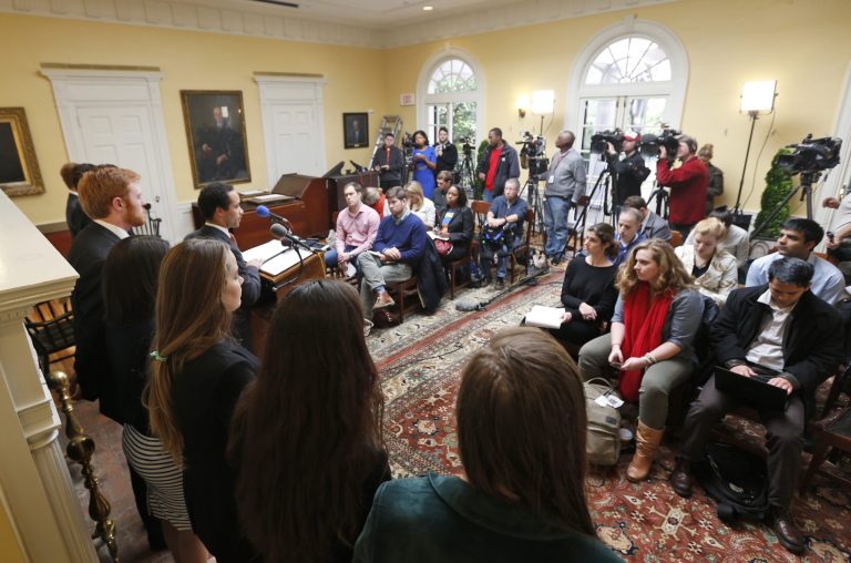 Jalen Ross, at podium, president of the University of Virginia student council, ponders a question during a news conference at the University of Virginia in Charlottesville, Va., Monday, Nov. 24, 2014. (AP/Steve Helber)