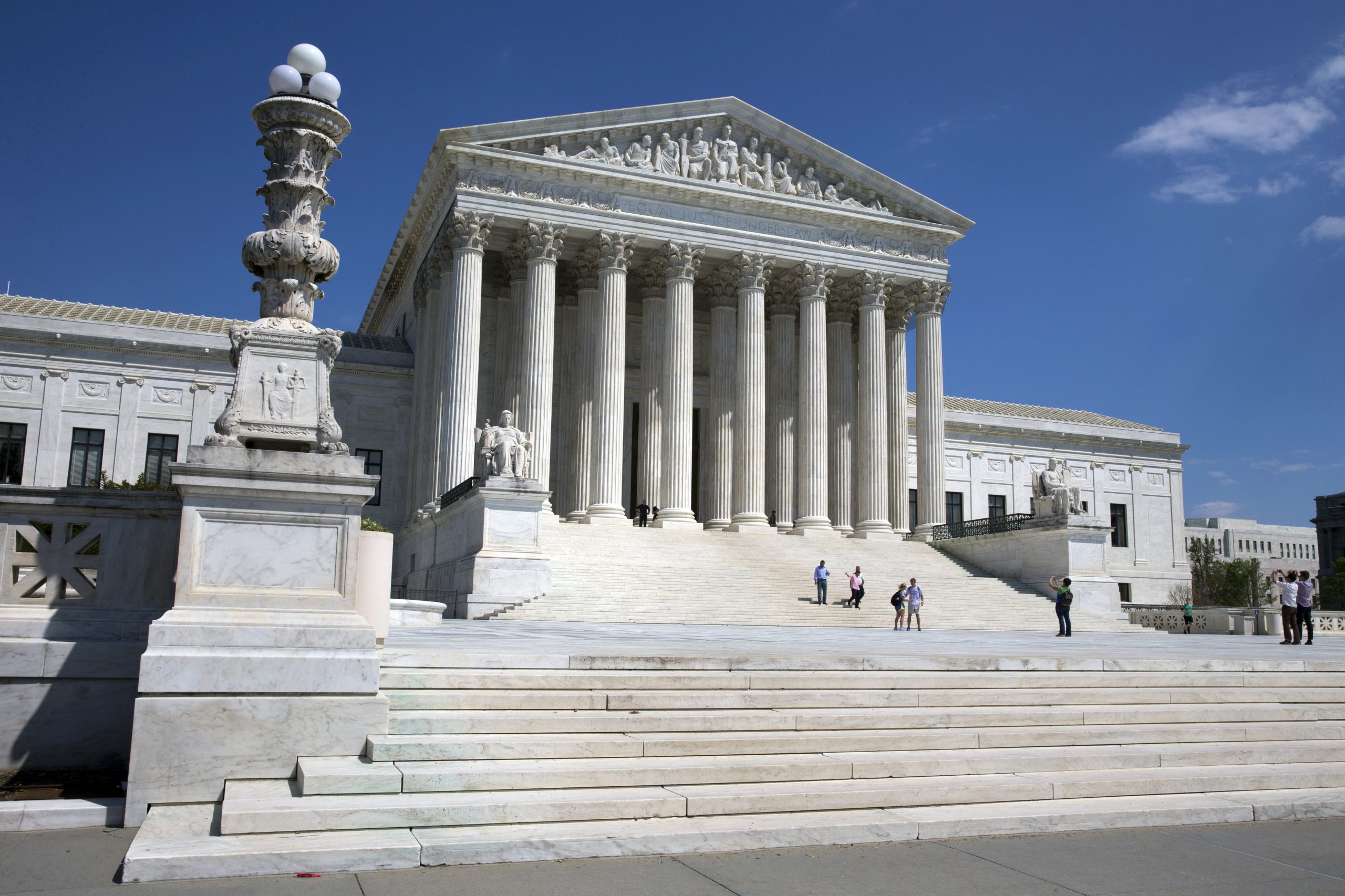 Supreme Court appears closely divided on Trump’s travel ban