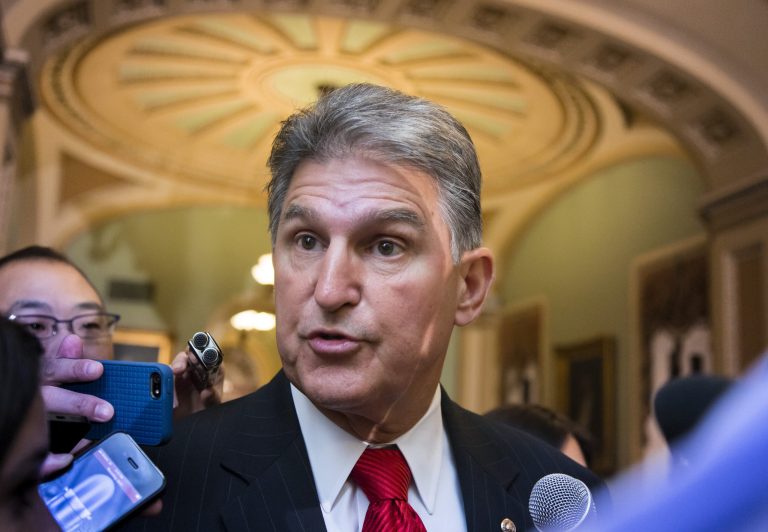 Sen. Joe Manchin, D-W.Va., who has called for a ban on Bitcoin, talks to reporters as he leaves a Democratic caucus meeting at the Capitol in Washington on Sept. 17. (AP Photo/J. Scott Applewhite)