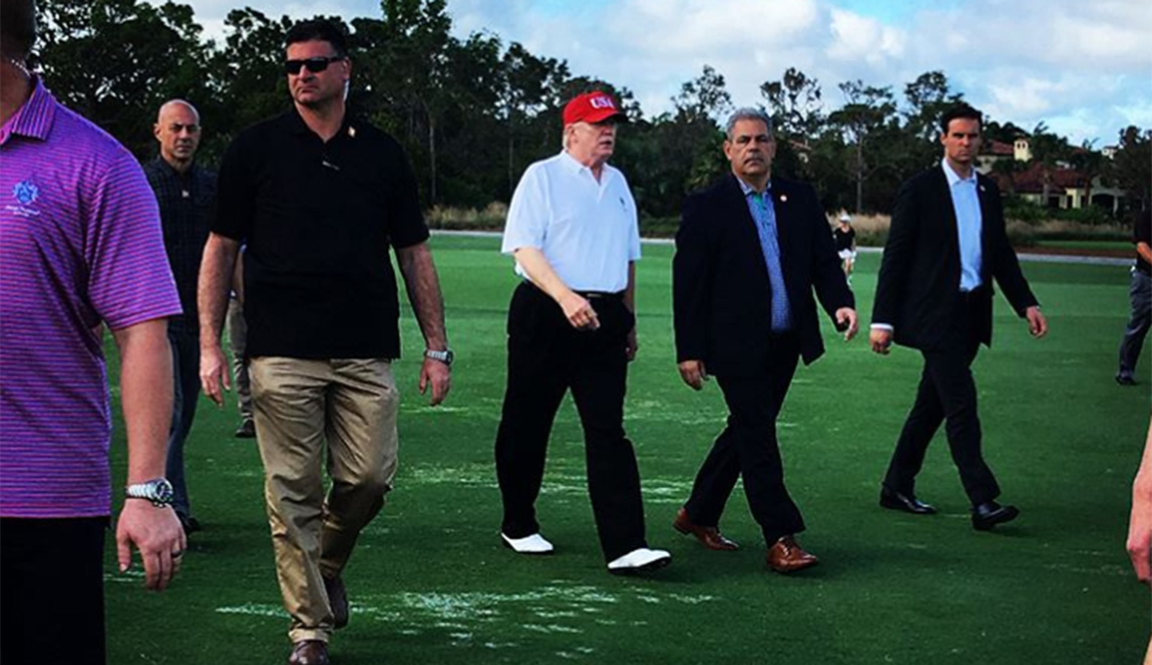 Trump greets Tiger Woods, fans during his round at golf course in Florida