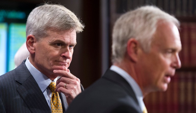 Republican Sen. Bill Cassidy (pictured left) said a last-dash effort to repeal Obamacare isn't meant to be partisan and that he is reaching out to Democrats. (AP Photo/Cliff Owen)