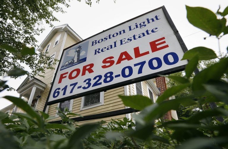 This July 10, 2014 photo shows a home for sale in Quincy, Mass. Freddie Mac reports on average U.S. mortgage rates for this week on Thursday, July 17, 2014. (AP Photo/Michael Dwyer)