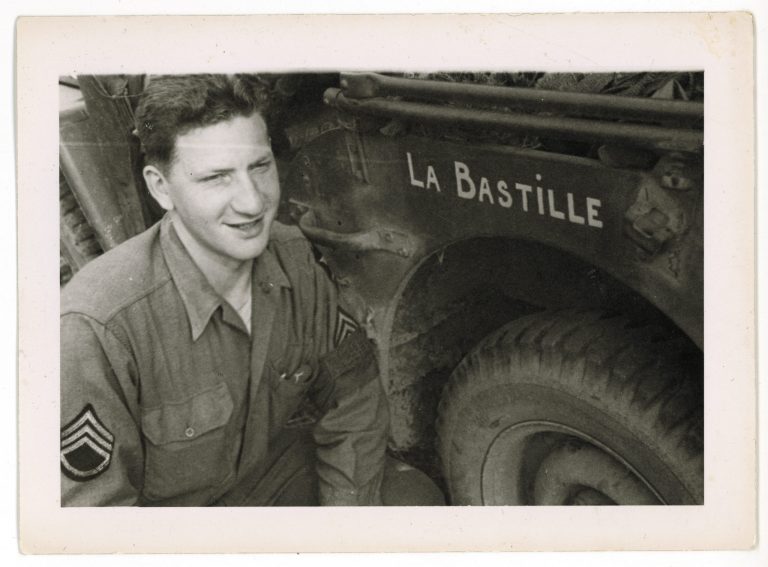 ADVANCE FOR STORY SLUGGED D-DAY FRENCH GI BY LORI HINNANT FOR RELEASE ON WEDNESDAY, MAY 28, 2014. In this photo dated July 1944 and provided by Dargols' family shows Bernard Dargols posing next to a  Willys MB U.S. Army Jeep in Normandy, France. When the young Frenchman left Paris at age 18, the plan was to go to New York for a year and learn the sewing machine trade. Six years later, Bernard Dargols found himself crossing the English Channel in a U.S. Army uniform, sloshing ashore at Omaha Beach to a homeland that had stripped his Jewish family of their rights and sent some to die in concentration camps. This French GI, now in his 90s, recounts to AP his remarkable story. (AP Photo/Courtesy of Bernard Dargols' family)