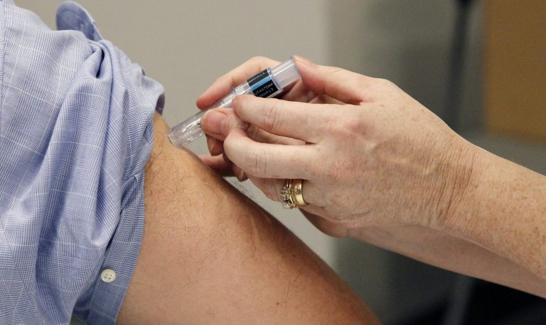   FILE - This Oct. 17, 2012 file photo shows a flu shot administered in Jackson, Miss. More children than ever got vaccinated against the flu last year, and health officials are urging families to do even better this time around. A severe flu strain swept the country last winter, sparking a scramble for last-minute vaccinations. There's no way to predict if this year will be as bad. But protection requires a yearly vaccine, either a shot or nasal spray. The Centers for Disease Control and Prevention said Thursday it's time for people to start getting immunized. (AP Photo/Rogelio V. Solis, File)  