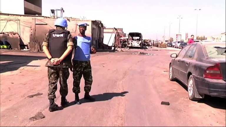   This image made from video released by UNSMIS, the UN observer mission in Syria and accessed Saturday, June 9, 2012, purports to show UN observers touring after overnight fighting in Damascus, Syria. In Damascus, residents spoke about a night of shooting and explosions in the worst violence Syria's capital has seen since the uprising against President Bashar Assad's regime began 15 months ago.(AP Photo/UNSMIS via AP video)  