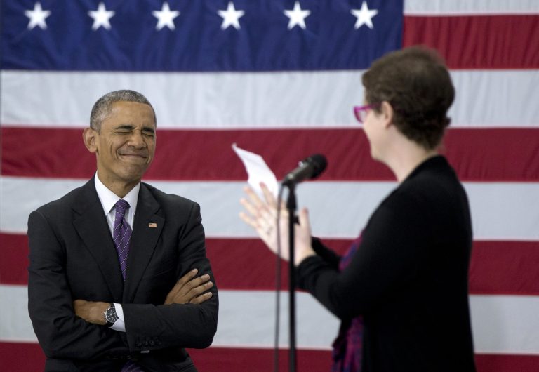 President Barack Obama reacts as he is acknowledged by Kelly Bryant on stage at Taylor Stratton Elementary School in Nashville, Tenn., Wednesday, July 1, 2015, where he talked about the Affordable Care Act. The president said he wants to refocus on improving health care quality, expanding access and rooting out waste now that the Supreme Court has upheld a key element of his health care law. (AP Photo/Carolyn Kaster)