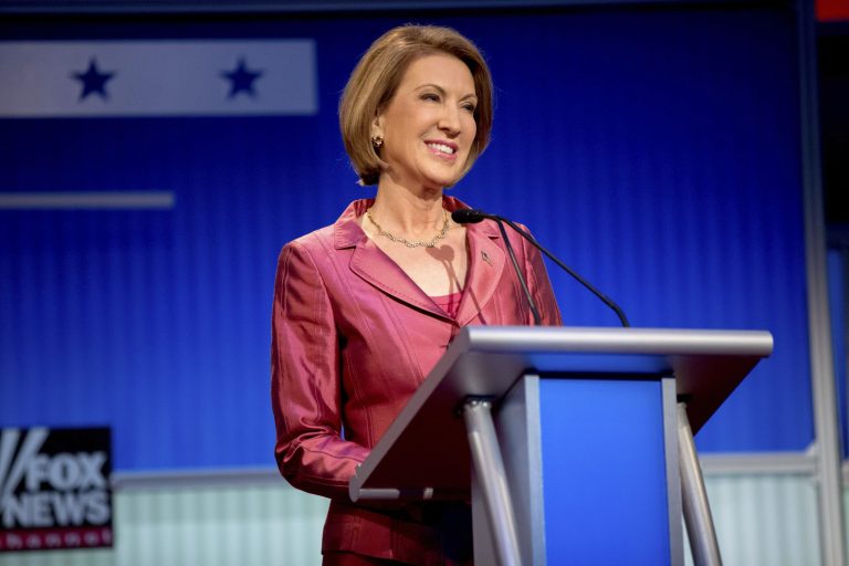 Republican presidential candidate businesswoman Carly Fiorina stands on stage for a pre-debate forum at the Quicken Loans Arena, Thursday, in Cleveland. (AP Photo/Andrew Harnik)