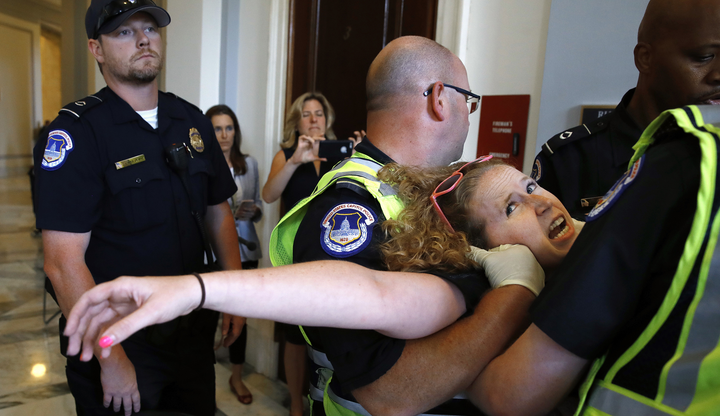 Wheelchair-bound protesters removed from protest outside Mitch McConnell’s office