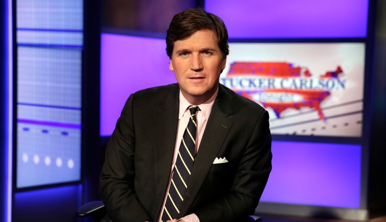 Tucker Carlson, host of "Tucker Carlson Tonight," poses for photos in a Fox News Channel studio, in New York, Thursday, March 2, 2017.
