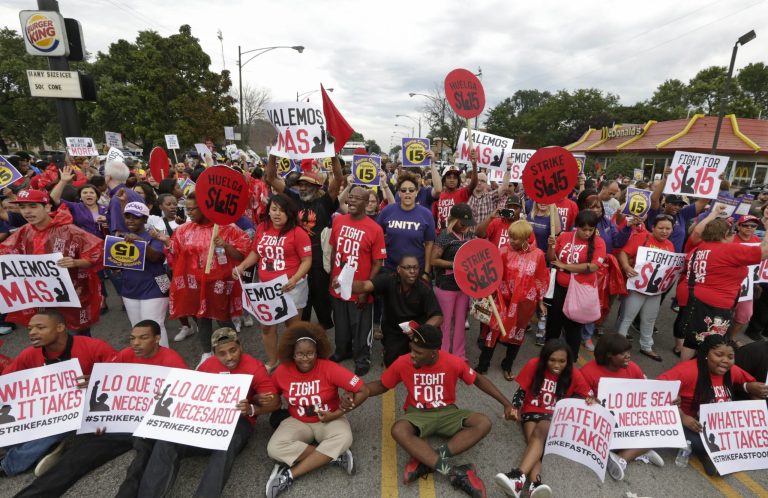 Protesters participate in a display of civil disobedience as labor organizers escalate their campaign to unionize the industry's workers. (AP Photo/M. Spencer Green)