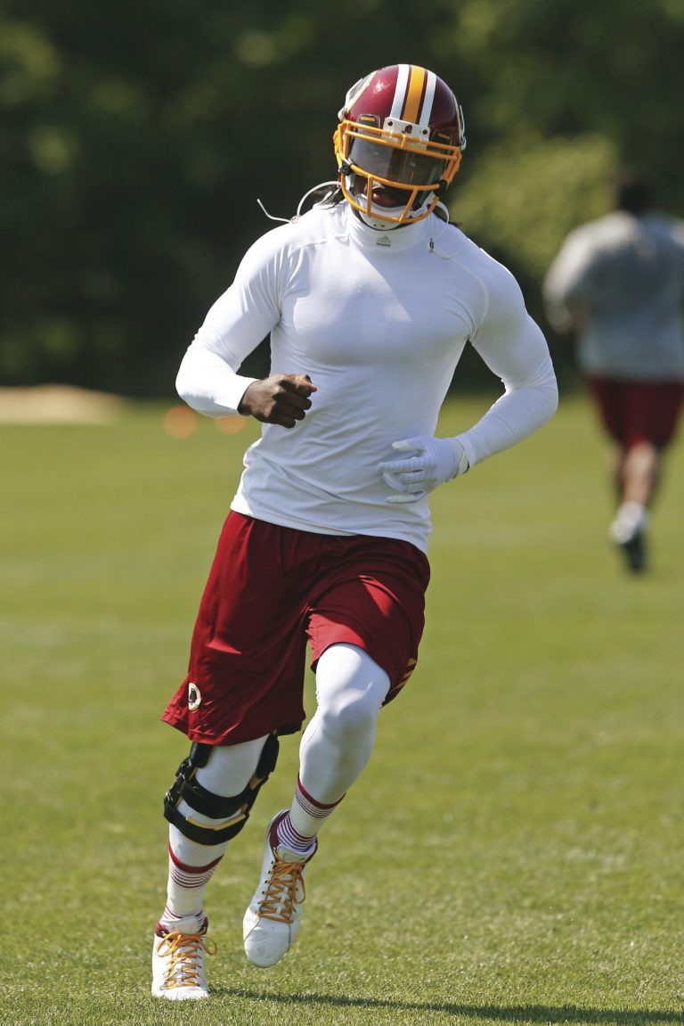 Charles Dharapak/AP
Redskins quarterback Robert Griffin III's press conferences at team OTAs are becoming a 