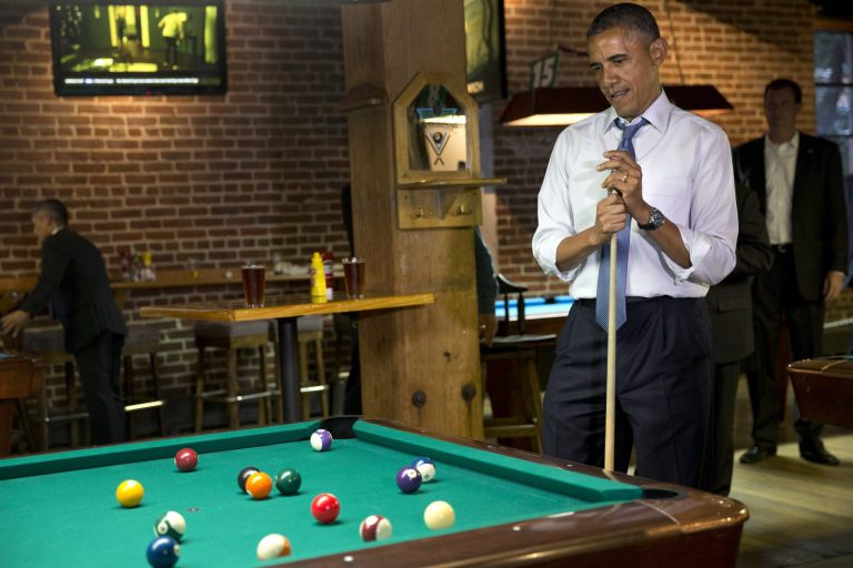President Obama plays pool at Wynkoop Brewing Co. with Colorado Gov. John Hickenlooper on Tuesday in Denver. (AP Photo/Jacquelyn Martin)