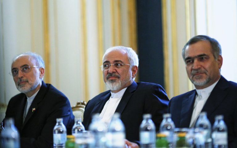 Iranian Foreign Minister Mohammad Javad Zarif, centre, Head of the Iranian Atomic Energy Organization Ali Akbar Salehi, left, and Hossein Fereydoon, brother and close aide to President Hassan Rouhani, meet with U.S. Secretary of State John Kerry in Vienna, Austria, Friday July 3, 2015. (Carlos Barria/Pool via AP)