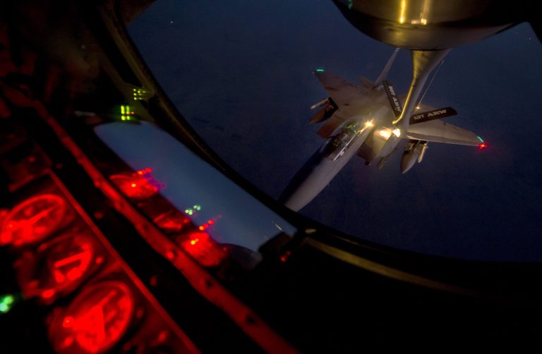 In this Tuesday, Sept. 23, 2014 photo provided by the U.S. Air Force, a F-15E Strike Eagle receives fuel from a KC-135 Stratotanker over northern Iraq after conducting airstrikes in Syria. (AP Photo/U.S. Air Force, Matthew Bruch)