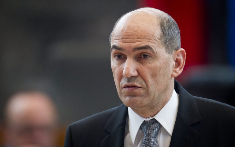 FILE - In this Wednesday, Feb. 27, 2013 file photo Slovenia's Prime Minister Janez Jansa speaks before the parliament during a no-confidence vote meeting in Ljubljana, Slovenia.  Slovenian ex-Prime Minister Janez Jansa was granted a brief prison furlough on Friday to attend the country's first parliamentary session after he won a seat in last month's election. Jansa, leader of the opposition Slovene Democratic Party, has been serving a two-year sentence for bribery since June. He arrived unescorted to the parliamentary session as several hundred supporters gathered outside the building. He was expected to return to prison once the session ends. (AP Photo/Darko Bandic, File)