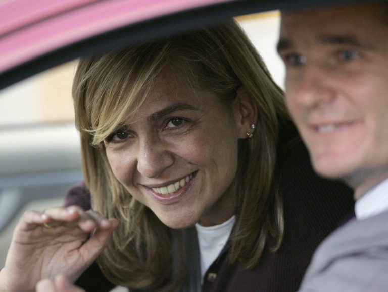 FILE- Spain's Princess Cristina waves from inside a car beside her husband Inaki Urdangarin, in Madrid, Spain, in this file photo dated Wednesday Nov. 2, 2005. A Spanish court has named the king's daughter Princess Cristina Wednesday April 3, 2013, as a suspect in an alleged corruption case involving her husband, and the court has announced that it will call her for questioning. The Spanish royal palace refused to comment. (AP Photo/Daniel Ochoa de Olza, File)