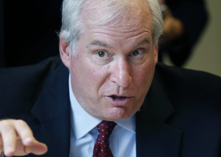 President and CEO of the Federal Reserve Bank of Boston Eric Rosengren speaks with staff during a visit to the office of CONNECT, a coalition of local organizations that provides employment services in Chelsea, Mass., Thursday, Oct. 16, 2014. (AP Photo/Michael Dwyer)