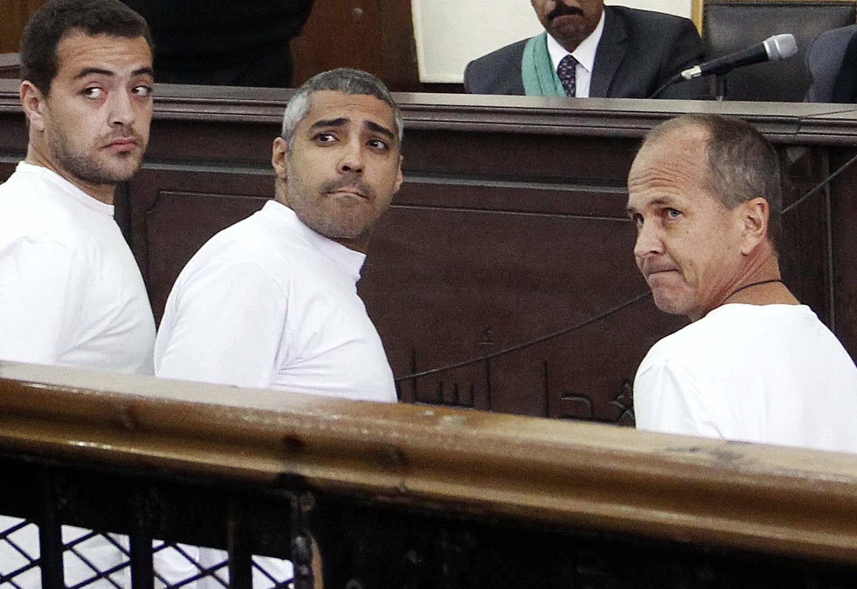Thumbnails of the 3 jailed Al-Jazeera journalists