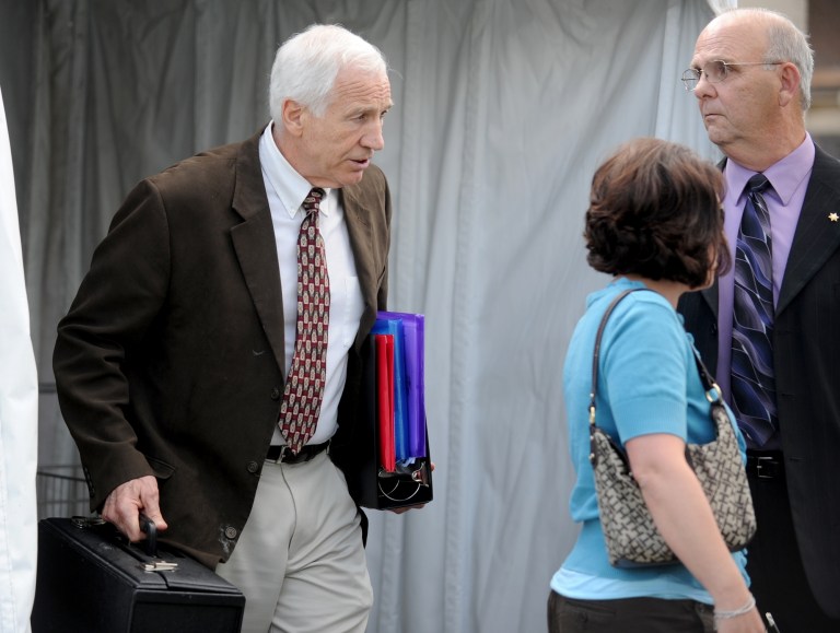   Jerry Sandusky, left, leaves the Centre County Courthouse and walks toward his attorney Joe Amendola's car Thursday, June 14, 2012, in Bellefonte, Pa. The prosecution's case in Sandusky's sex abuse trial neared its conclusion on Thursday after just four days of testimony, with three more accusers taking the witness stand, including a young man who said the former Penn State assistant football coach raped him as a teen guest in Sandusky's home. (AP Photo/Centre Daily Times, Abby Drey) MANDATORY CREDIT ALTOONA MIRROR OUT LOCK HAVEN EXPRESS OUT CLEARFIELD PROGRESS OUT HARRISBURG PATRIOT-NEWS OUT CENTRE COUNTY GAZETTE / STATECOLLEGE.COM OUT  