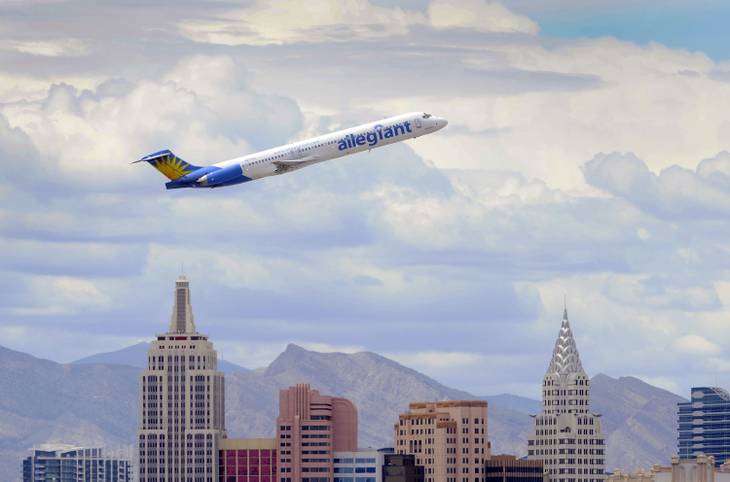 An Allegiant Air jetliner flies over the the the New York-New York Hotel & Casino after taking off from McCarran International Airport in Las Vegas. AP Photo