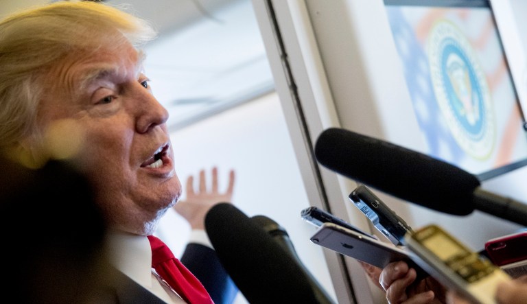 President Trump, speaking to reporters aboard Air Force One, dismissed intelligence heads who claim there was Russian interference in the 2016 election as "political hacks."