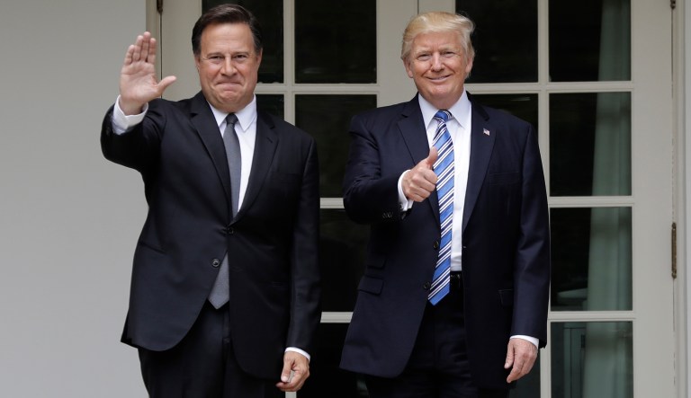 President Donald Trump and Panamanian President Juan Carlos Varela gestures after Varela's arrival at the White House in Washington, Monday, June 19, 2017. (AP Photo/Evan Vucci)