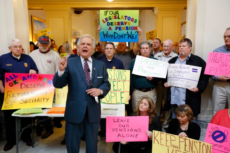 Oklahoma State Rep. Richard Morrissette talks with public employees during a rally at the State Capitol in Oklahoma City, Monday, Feb. 17, 2014. Hundreds of teachers, firefighters and state employees visited with their legislators and urged them to stop a Republican-backed plan to shift newly hired state employees from the current traditional defined-benefit pension system to a 401(k)-style defined-contribution retirement plan. (AP Photo/The Oklahoman, Steve Gooch)