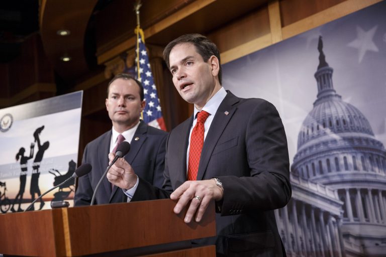 Sen. Marco Rubio, R-Fla., right, accompanied by Sen. Mike Lee, R-Utah, outline their ideas for a new tax plan during a news conference on Capitol Hill in Washington, Wednesday, March 4, 2015. (AP Photo/J. Scott Applewhite)