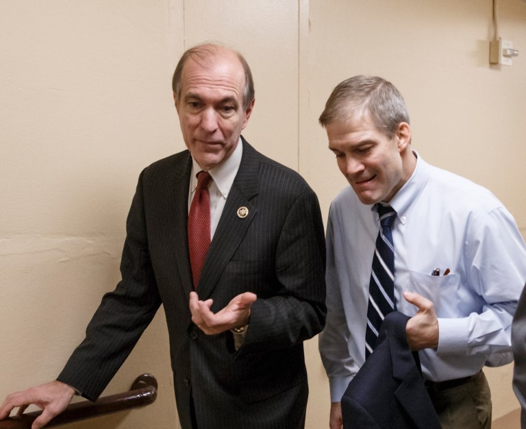 Rep. Scott Garrett, R-N.J., left, walks with Rep. Jim Jordan, R-Ohio on Capitol Hill in Washington. (AP Photo/J. Scott Applewhite)
